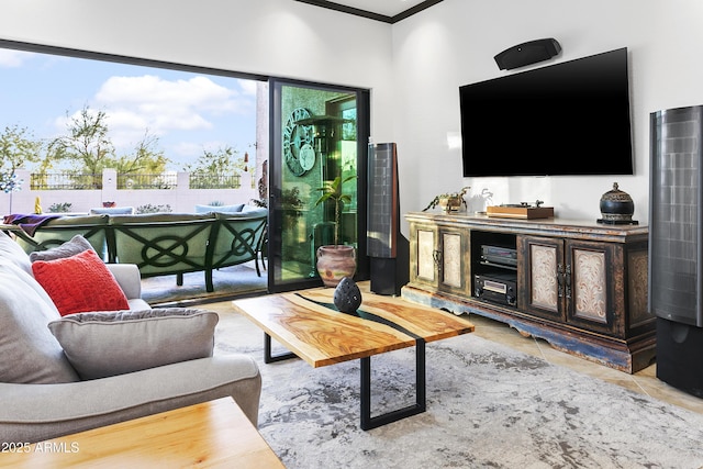 living room featuring light tile patterned floors and crown molding