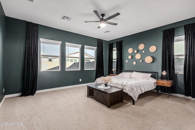 bedroom with light carpet and ceiling fan