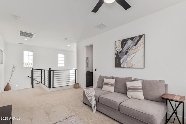 living room with carpet and ceiling fan