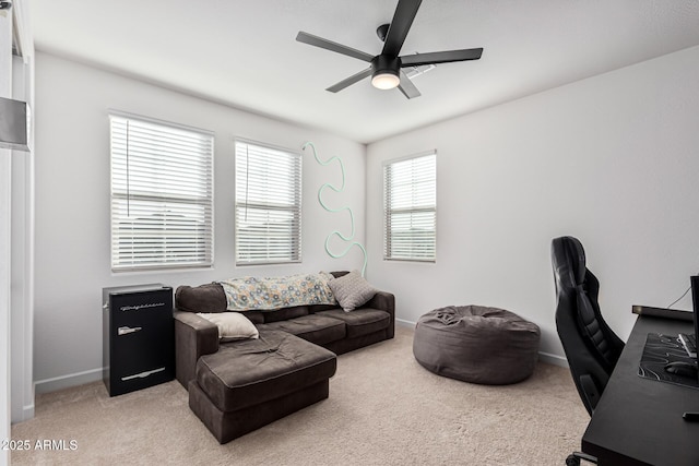 carpeted living room featuring ceiling fan