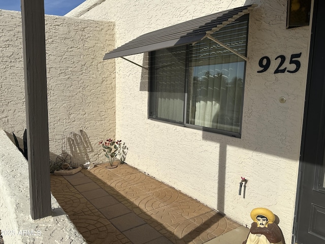 view of side of property featuring stucco siding