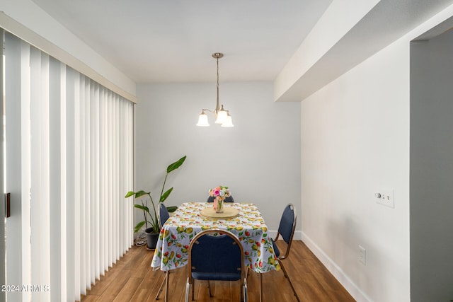 dining space featuring an inviting chandelier and wood-type flooring