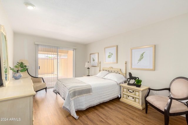 bedroom with hardwood / wood-style floors