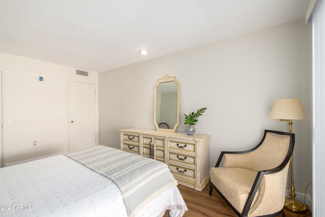 bedroom with hardwood / wood-style flooring