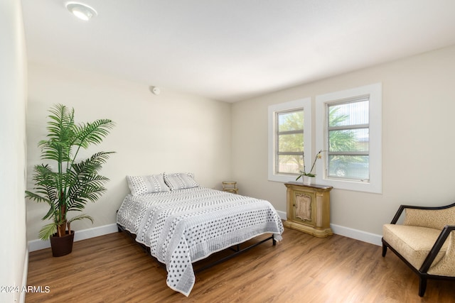 bedroom featuring hardwood / wood-style flooring