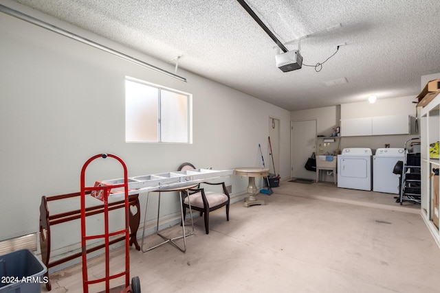 garage with separate washer and dryer and a garage door opener