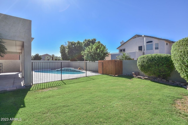 view of yard featuring a fenced in pool and a patio area