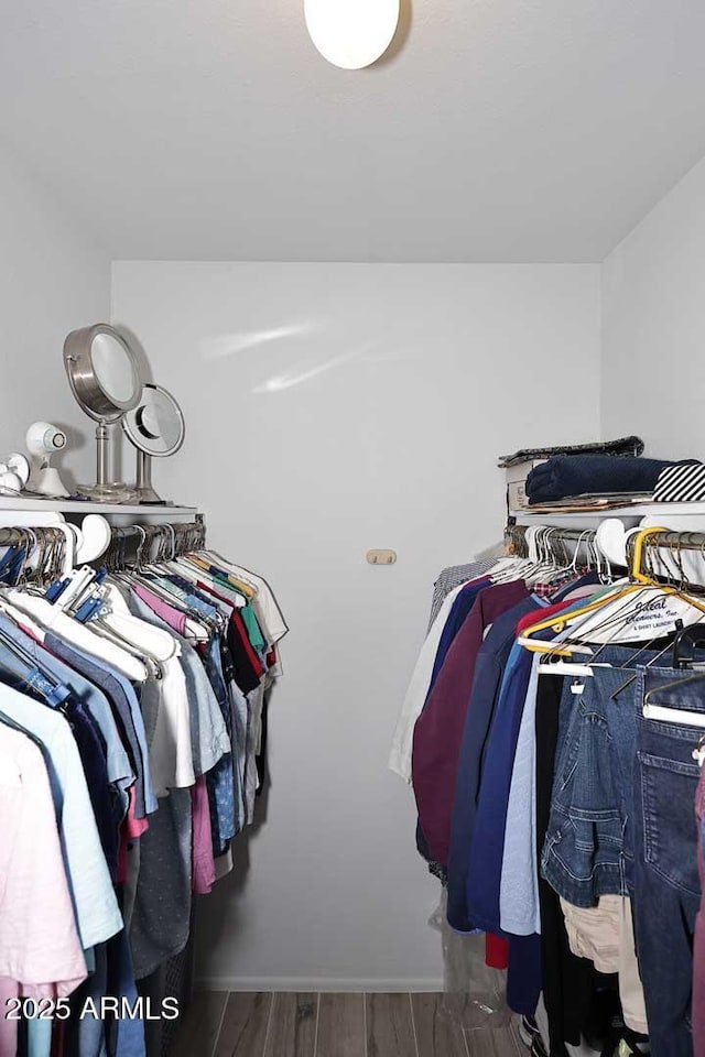 spacious closet featuring hardwood / wood-style floors