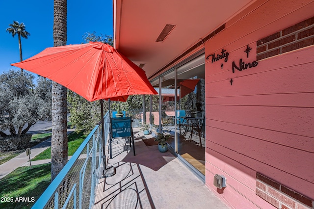 view of patio with a balcony