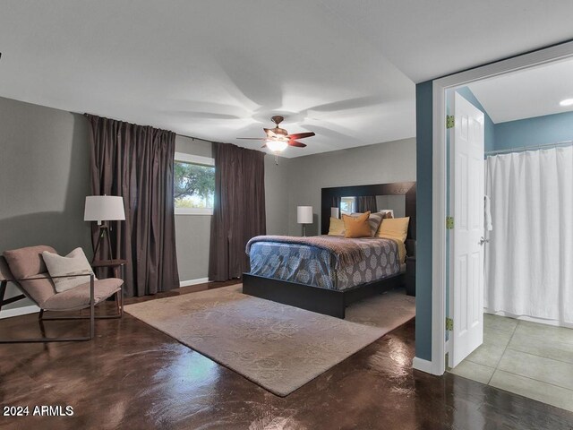 bedroom featuring ceiling fan and concrete flooring