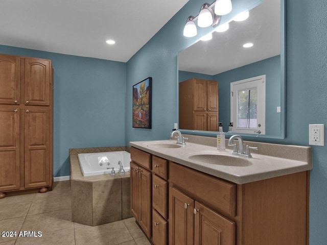 bathroom with vanity, tile patterned floors, and tiled tub