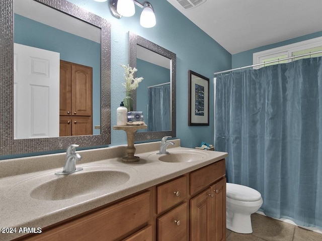 bathroom featuring tile patterned floors, vanity, and toilet