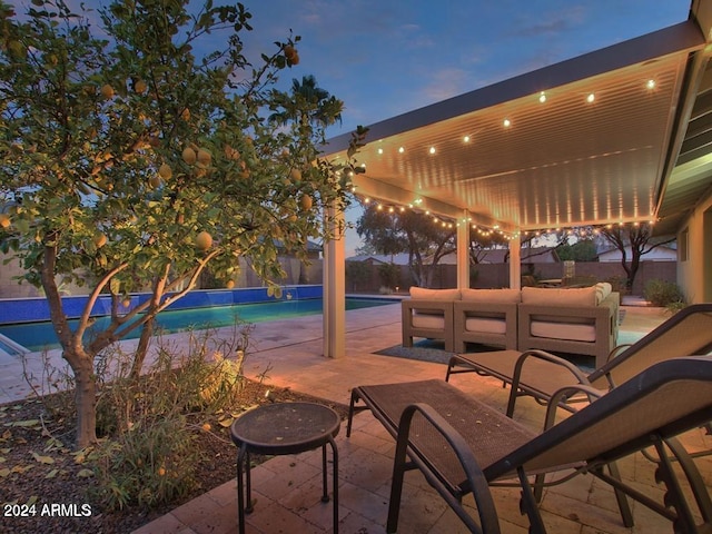 patio terrace at dusk with an outdoor living space