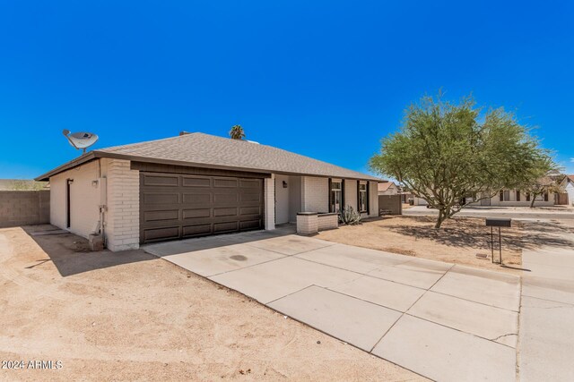 ranch-style house featuring a garage