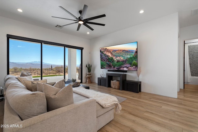 16533 E Dale Ln, Scottsdale, AZ 85262 - living room featuring ceiling fan, recessed lighting, and light wood-style floors
