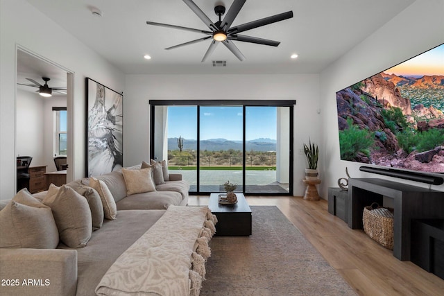16533 E Dale Ln, Scottsdale, AZ 85262 - living area featuring ceiling fan, light wood-style flooring, healthy amount of natural light, and recessed lighting