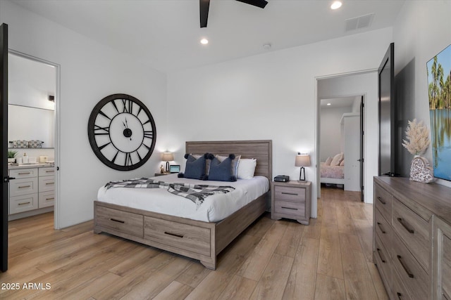 16533 E Dale Ln, Scottsdale, AZ 85262 - bedroom with light wood-style floors, recessed lighting, ceiling fan, and connected bathroom