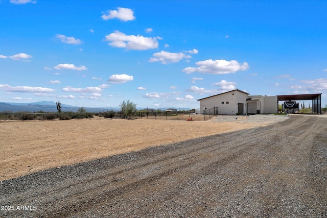 16533 E Dale Ln, Scottsdale, AZ 85262 - view of yard featuring driveway, a detached carport, a mountain view, and a view of countryside