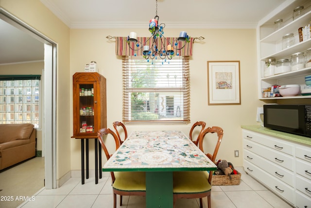 1441 E Hubbell St, Phoenix, AZ 85006 - dining space with light tile patterned floors, a chandelier, and crown molding