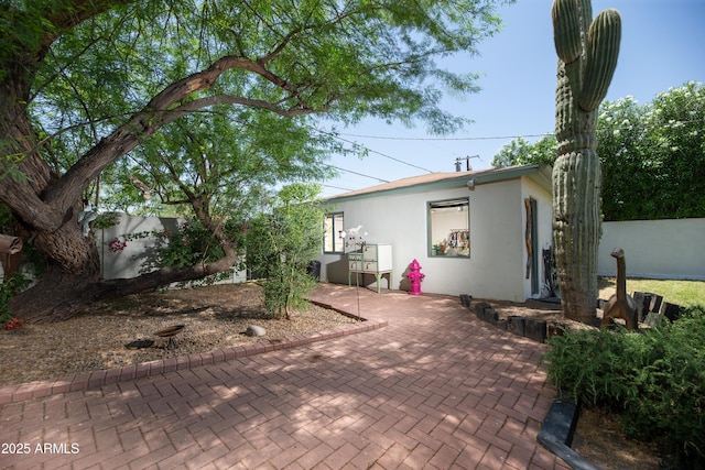 1441 E Hubbell St, Phoenix, AZ 85006 - view of front of home featuring stucco siding, a patio, and a fenced backyard