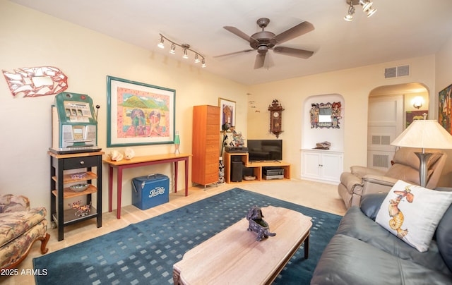 1441 E Hubbell St, Phoenix, AZ 85006 - carpeted living room featuring ceiling fan, rail lighting, and arched walkways