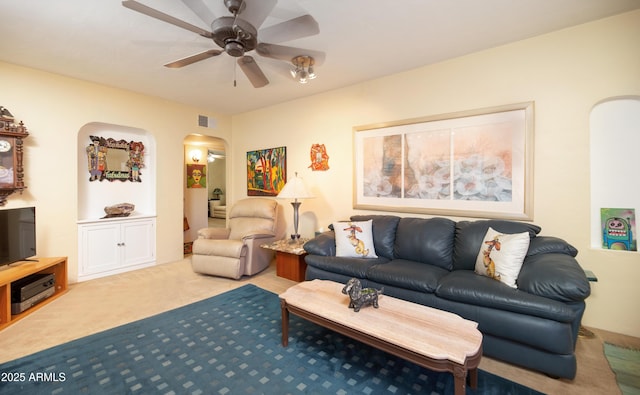 1441 E Hubbell St, Phoenix, AZ 85006 - living area with arched walkways, carpet flooring, and a ceiling fan