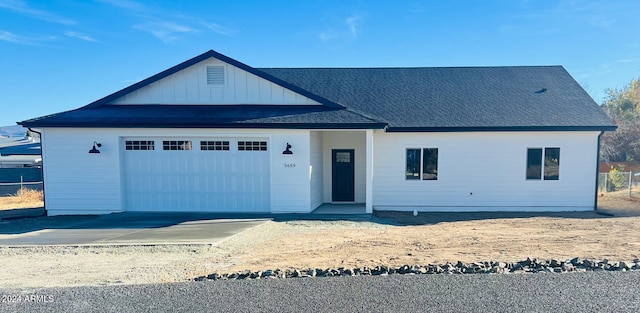 view of front of property with a garage