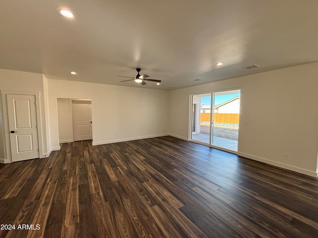 empty room featuring ceiling fan and dark wood-type flooring