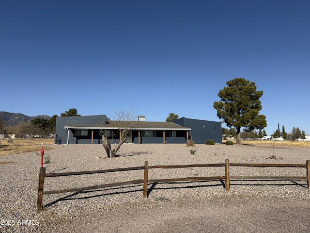 view of front of house with fence