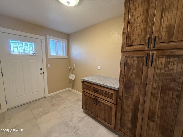 entrance foyer featuring baseboards