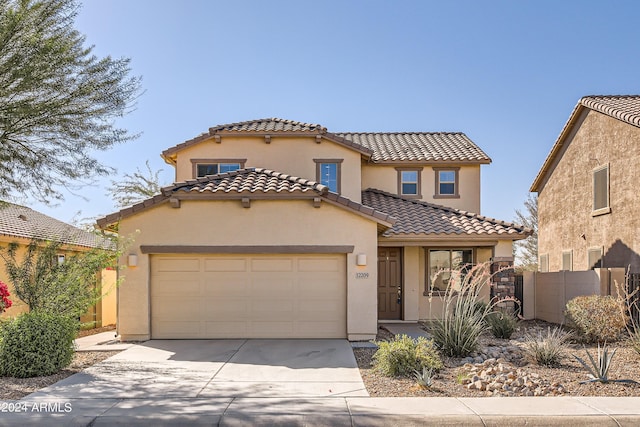 mediterranean / spanish-style home featuring a garage