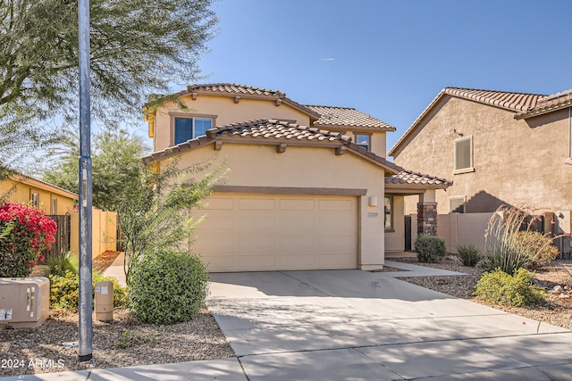 mediterranean / spanish-style house featuring a garage