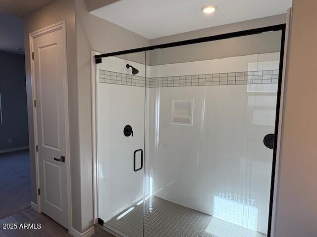 bathroom with a shower stall