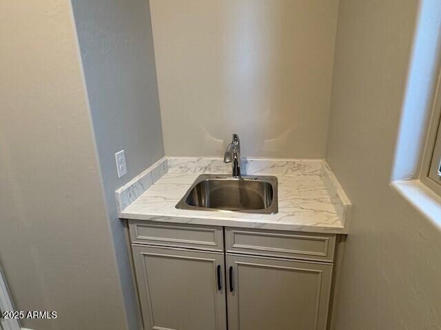 bar featuring a sink