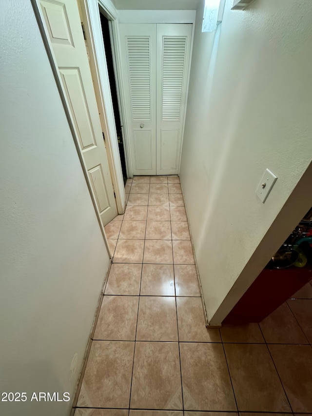 hallway with light tile patterned floors