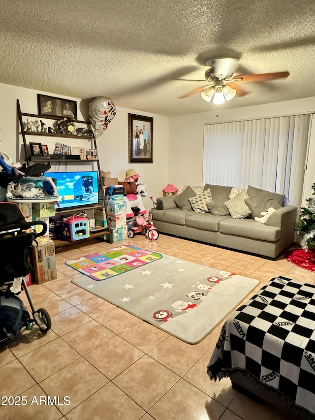 living room with a textured ceiling and tile patterned floors