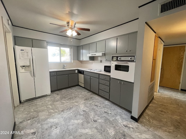 kitchen featuring white appliances, gray cabinets, ceiling fan, and sink