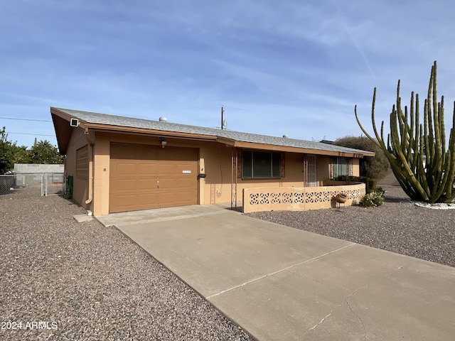 ranch-style home featuring a garage