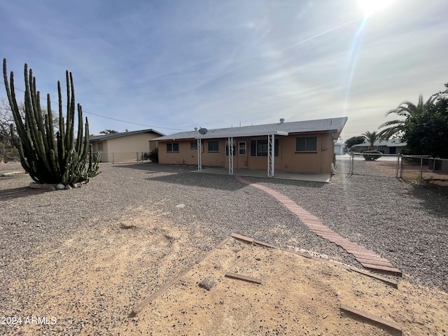 back of house with a patio area