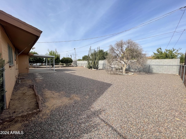 view of yard with a carport