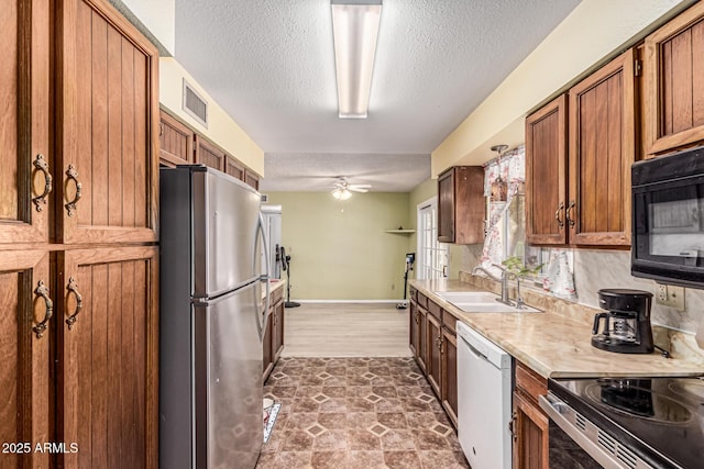 421 S 113th Way, Mesa, AZ 85208 - kitchen featuring freestanding refrigerator, a sink, white dishwasher, black microwave, and light countertops