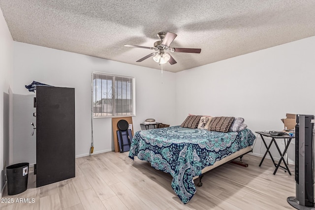 421 S 113th Way, Mesa, AZ 85208 - bedroom with wood finished floors, a textured ceiling, baseboards, and ceiling fan