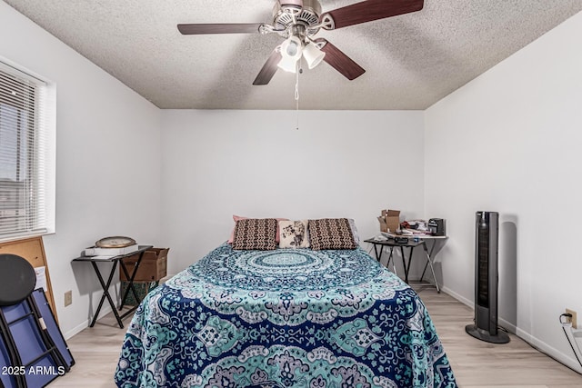 421 S 113th Way, Mesa, AZ 85208 - bedroom with a textured ceiling, light wood-type flooring, baseboards, and ceiling fan