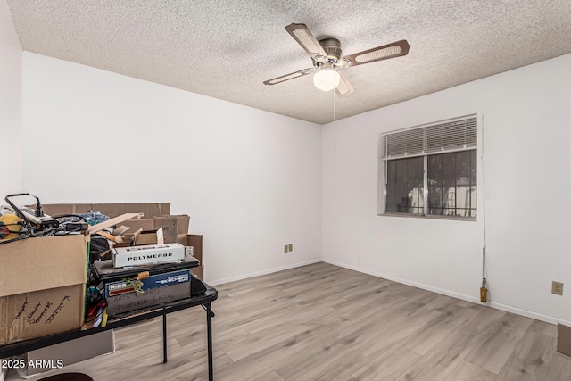 421 S 113th Way, Mesa, AZ 85208 - interior space featuring a textured ceiling, wood finished floors, a ceiling fan, and baseboards