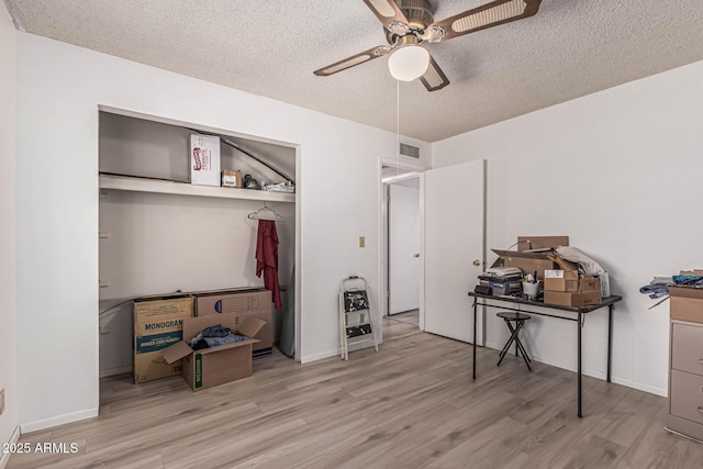 421 S 113th Way, Mesa, AZ 85208 - bedroom with wood finished floors, a textured ceiling, a closet, a ceiling fan, and heating unit