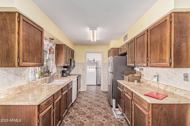 421 S 113th Way, Mesa, AZ 85208 - kitchen with a sink, washer / clothes dryer, light countertops, and appliances with stainless steel finishes
