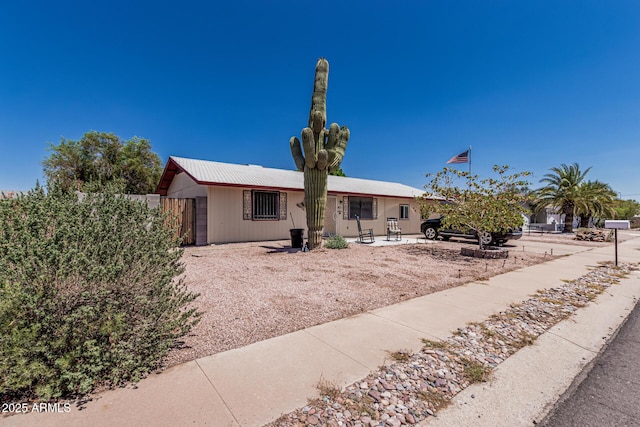 421 S 113th Way, Mesa, AZ 85208 - view of front of house featuring a patio and metal roof