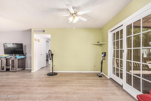 421 S 113th Way, Mesa, AZ 85208 - exercise room with a textured ceiling, wood finished floors, baseboards, and a ceiling fan