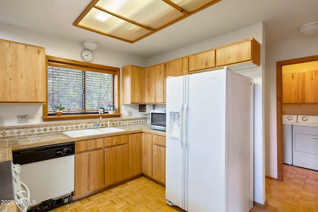 2288 Richenbacher Cir, Overgaard, AZ 85933 - kitchen featuring white appliances, a sink, washing machine and clothes dryer, and tile countertops