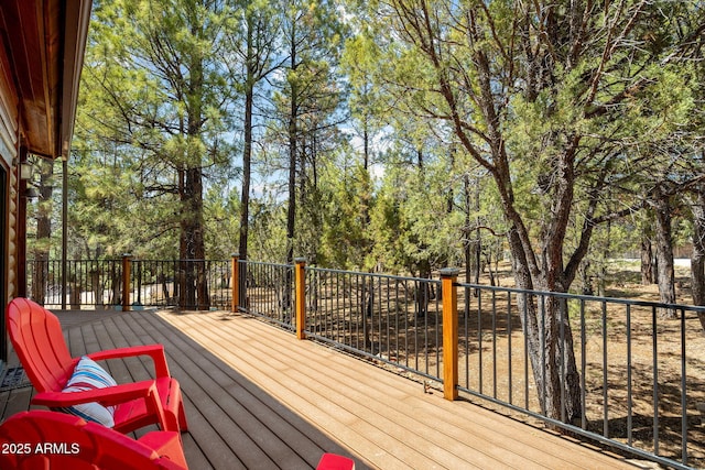 2288 Richenbacher Cir, Overgaard, AZ 85933 - wooden terrace featuring view of wooded area